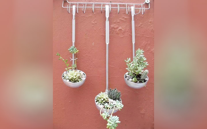 A Portable Planter With Kitchen Rack And Utensils