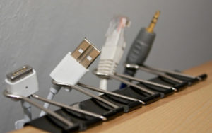 Use Binder Clips To Keep Cords And Cables From Falling Behind Your Desk